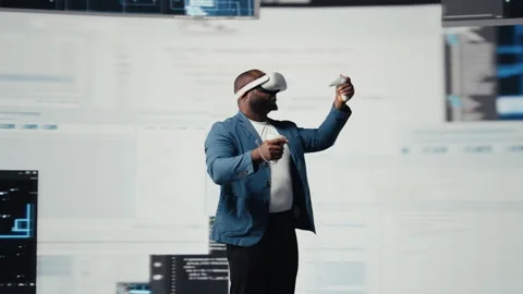 African American programmer engaging in virtual reality with a headset Stock-Footage 312360025