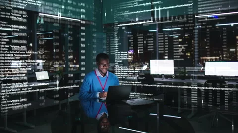 African-American programmer or broker working at computer in the data center Stock Footage 220553353