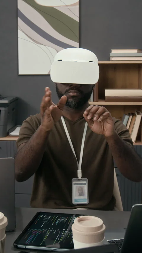 African American Programmer Using Virtual Reality Headset at Workplace Stock Footage 329617398
