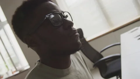 African American Programmer Writing Code on Computer Stock Footage 255781063