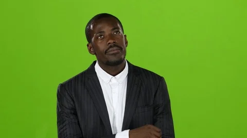 African american reflects on the main question and finds the answer. Green Video stock 76424403