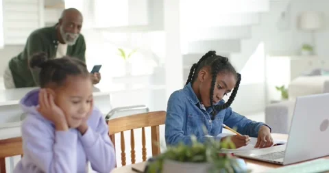 African American Senior man checking phone leaning monitoring work child in Stock Footage 346178908