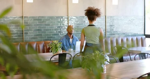 African American server entering in apron checking order, man using laptop Stock Footage 336247606