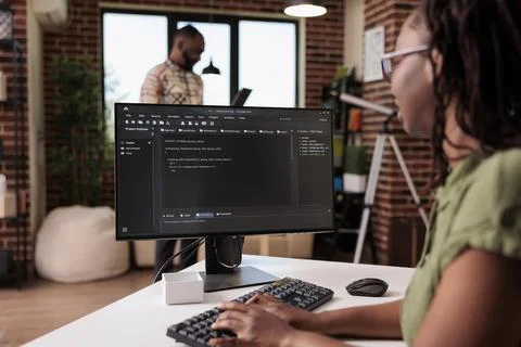African american software developer debugging source code algorithm looking at Stock Photos