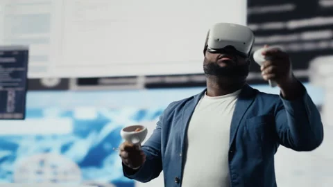 African american software developer uses virtual reality headset for coding Stock Footage 312301287