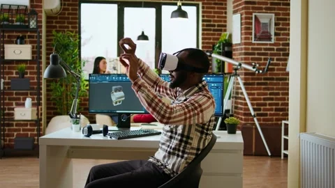 African american software developer working with virtual reality headset Stock Footage 319717931