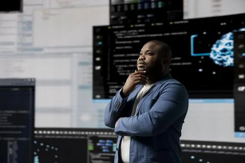 African american software engineer immersed in code development Stock Photos