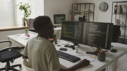 African American Software Engineer Programming in Office Stock Footage 255781064