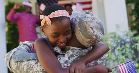 African american soldier father hugging smiling daughter with family and Stock Footage