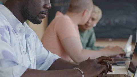 African American Student Coding on Laptop at Desk Stock Footage 257061962