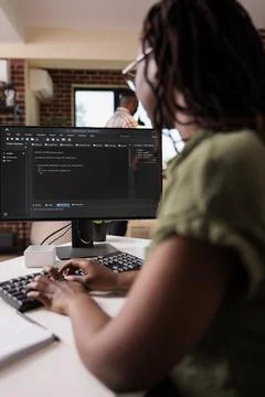 African american student learning programming writing source code while Stock Photos