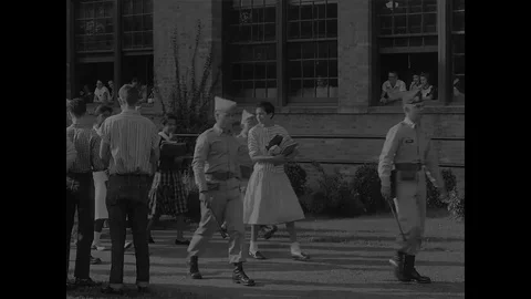 African American students being escorted up steps - 1957 Stock-Footage 94451010