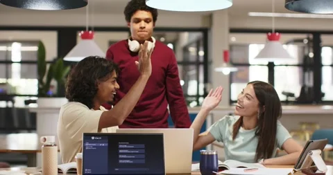 African American students at study area, standing man raising hand, high-fiving Stock Footage 335514414