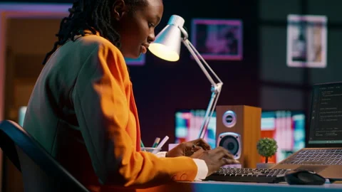 African american system engineer using AI system to write computer program code Stock Footage 265335044