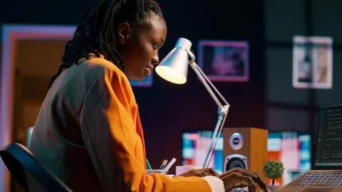 African american system engineer using AI system to write computer program code Stock Photos