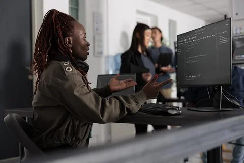 African american system engineer working on html code development Stock Photos