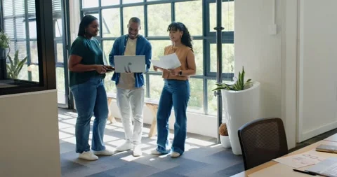 African American team leaning, checking laptop and tapping phone after seeing Stock Footage 339320932