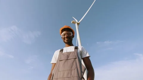 African american technician in helmet, glases and overalls looking at camera Stock Footage 170441453