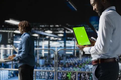 African american technician using copy space display on tablet 库存照片