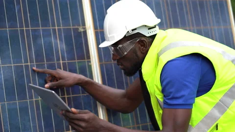 African american technician using laptop computer checking Solar Cell panels Stock Footage 154849048