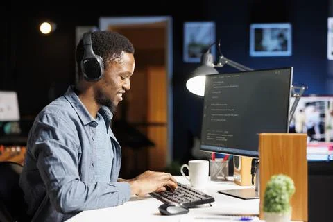 African american web developer coding server scripts on pc 스톡 사진