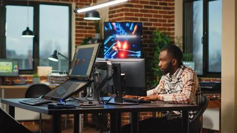 African american web developer working in artistic office to create CGI content 写真素材