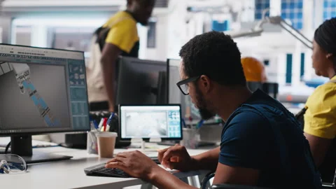 African american wheelchair user testing CAD software for manufacturing Stock Footage 309073197