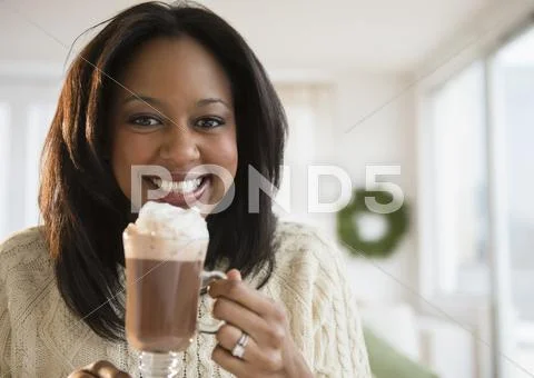 African American woman drinking hot chocolate Stock Photos