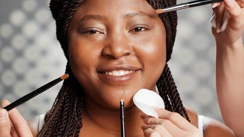 African american woman receiving makeover from team Stock Photos