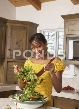 African American Woman Tossing Salad