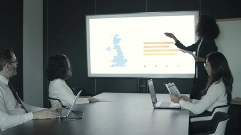 African American worker explaining data and pointing to charts Stock Footage 137510896