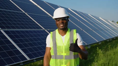 African American Worker At Solar Panel Plant. Photovoltaic Green Energy Stock Footage 246807804