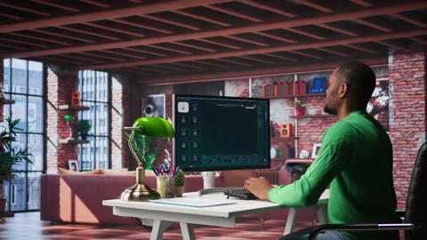 African American worker using generative AI program with photos Stock Footage 307799622