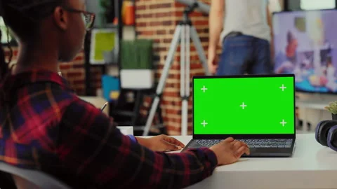 African american worker using greenscreen template on laptop Stock Footage 227419319