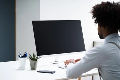 African American Working On Computer Stock Photos