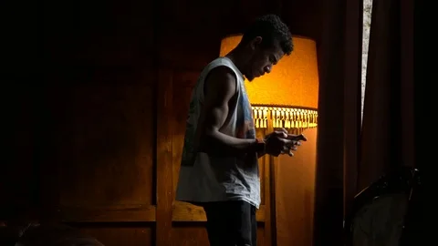 African American is worried before calling his new girlfriend, the guy in the Stock Footage 100089341