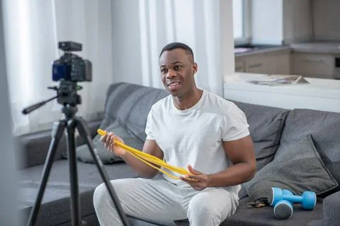 African american young man having an online tutorial 스톡 사진