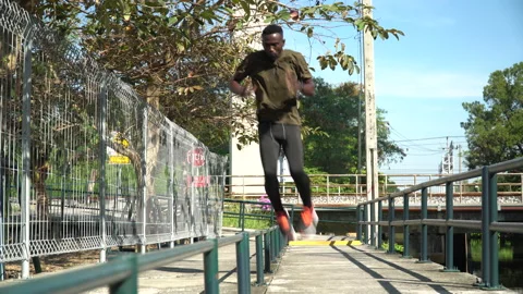 African american young runner man Practice Footwork Running Drill jumping in Stock Footage 146652091