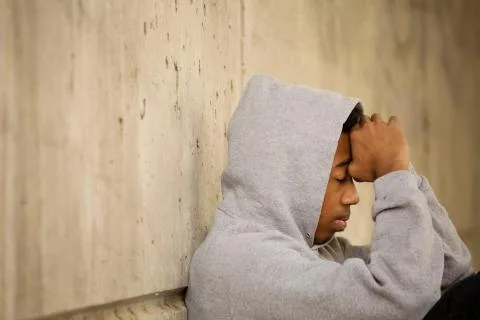 African American young teen feeling depressed. Stock Photos