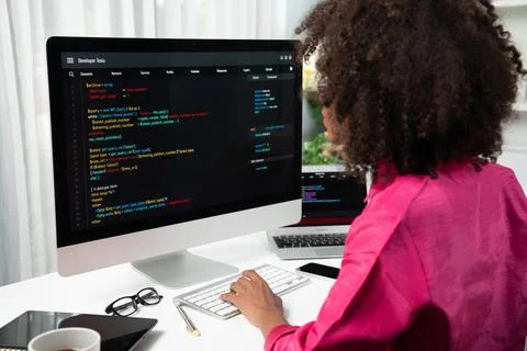 African American's developer. Coding Software project on screen. Tastemaker. Stock Photos