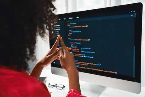 African American's developer. Coding Software project on screen. Tastemaker. Stockfoto's