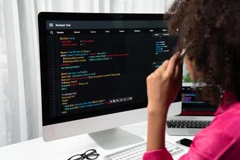 African American's developer. Coding Software project on screen. Tastemaker. 库存照片