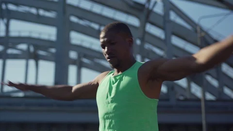 African athlete doing warm up arm exercise Stock Footage 117062343