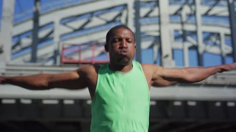 African athlete doing warm up exercise Video stock 117063820