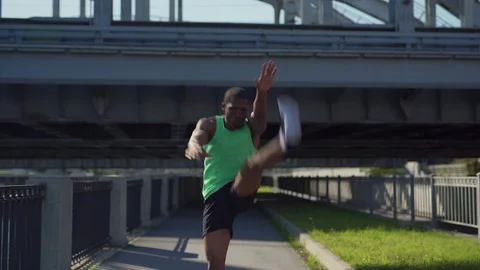 African athlete practicing high kick exercise Stock Footage 117063747