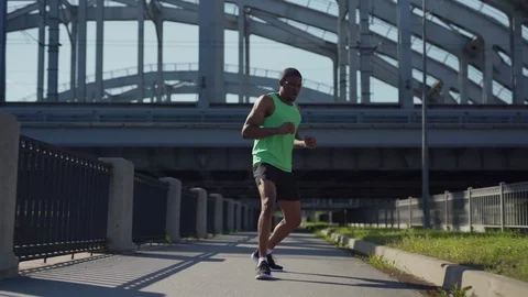 African athlete practicing running drill exercise Stock Footage 117062979