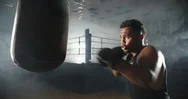 African Athlete Working With A Boxing Pear, Punching It With Boxing Gloves Stock Footage