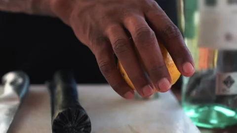 African bartender picking up passion fruit, slow motion Stock Footage 230080361