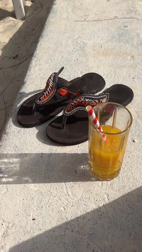 African beaded sandals fresh mango juice Paje beach Zanzibar HD vertical Stock Footage 342165964