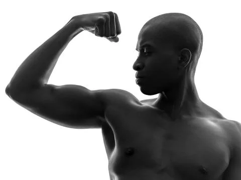 African black man flexing muscle  silhouette Stock Photos